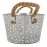 Oval metal basket with white spots